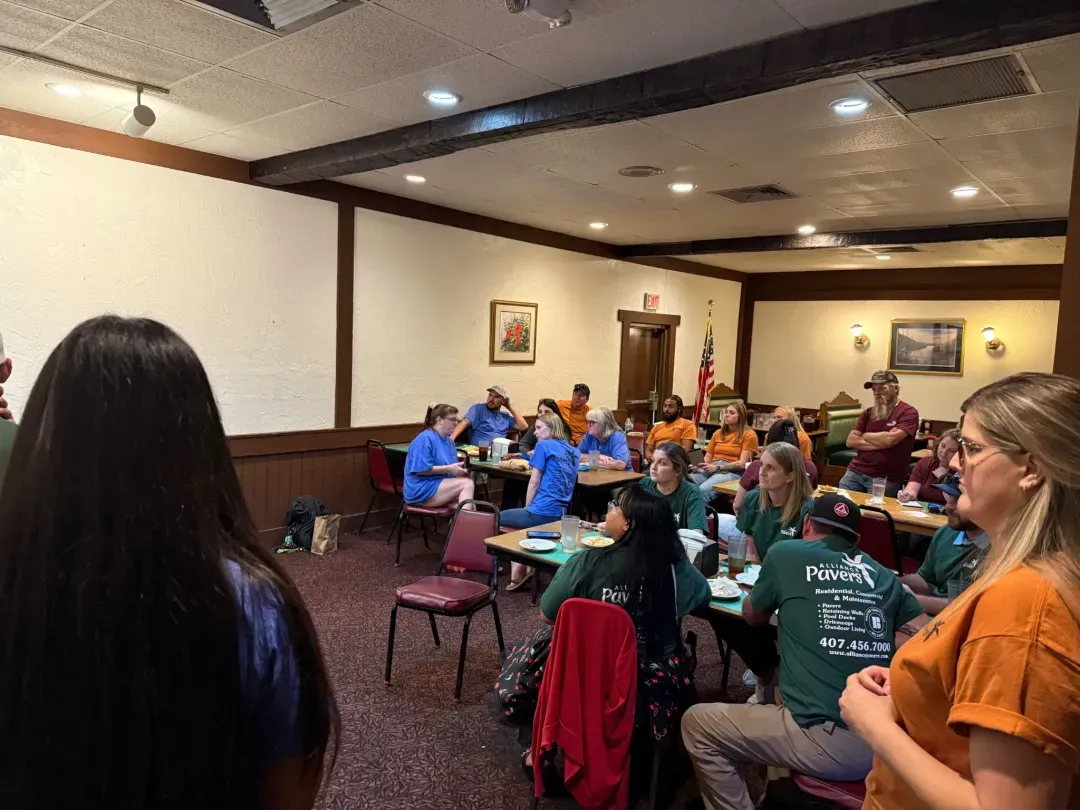 Alliance Pavers crew and staff listening during a team training session.