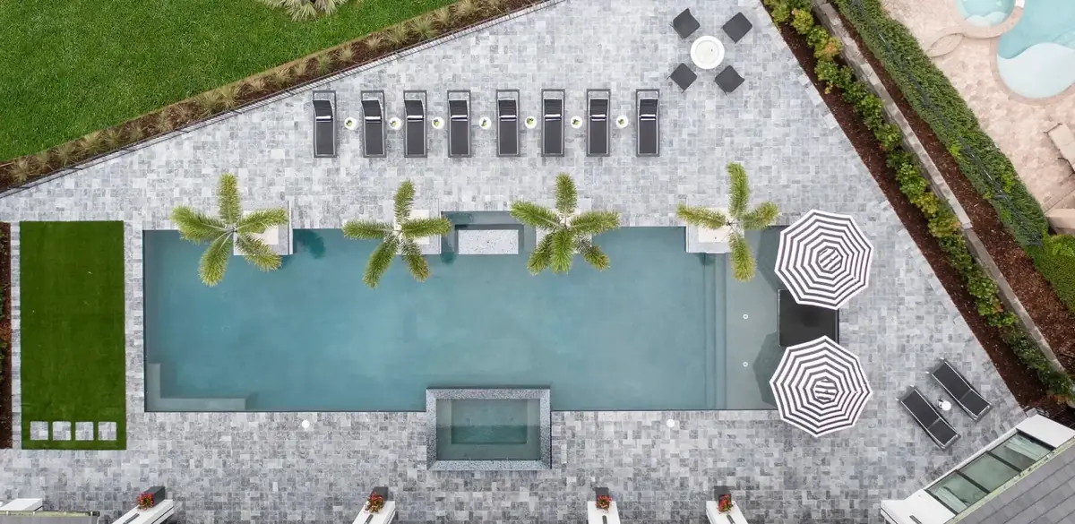 Paver pool deck with custom coping in Central Florida